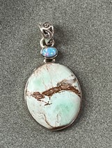 Small Lab Created Opal &amp; Light Blue w Brown Veins Oval Stone in 925 Silver Frame - $24.13