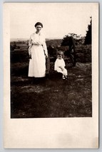 RPPC Edwardian Woman With Child Sitting On Artillery Cannon Postcard Q24 - £10.16 GBP