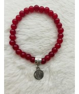 Red glass bead bracelet with charm. - $7.00