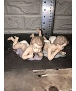 2 Vtg Porcelain Cherubs Angel Laying Foot Up  Figurines Hand Painted In ... - £34.89 GBP