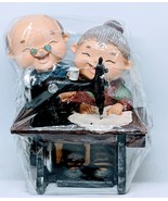 Elderly Couple On Sewing Machine Coin Bank - $30.00