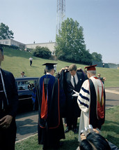 President John F. Kennedy puts on robe at American University in DC Phot... - $8.81+
