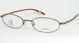 Vintage Calvin Klein 5121MGB 209 Bronze Olive Eyeglasses Glasses 50-18-130mm - £74.51 GBP
