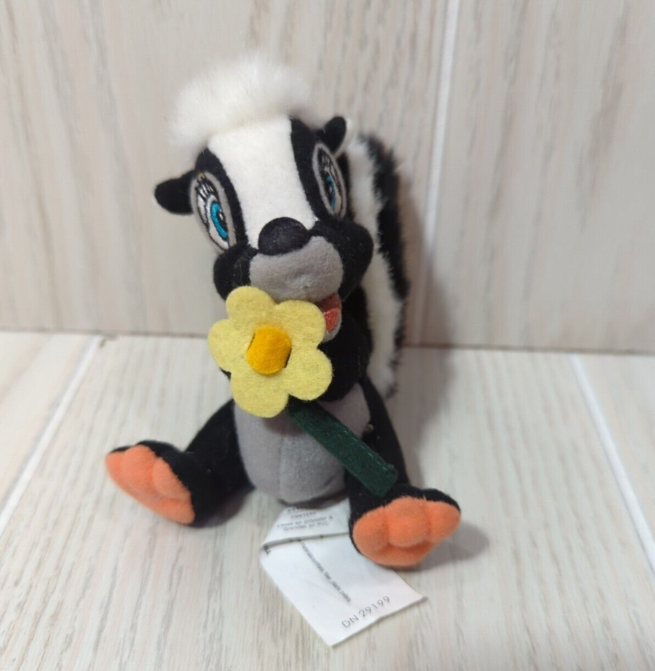 Primary image for Disney plush Bambi Skunk Flower Yellow Orange feet Small Mini stuffed animal