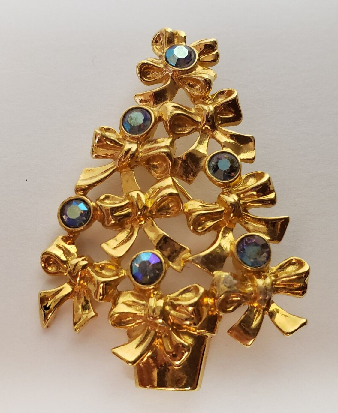 Primary image for Avon Bow Christmas Tree Rhinestone Brooch Pin Gold Tone Iridescent 2 1/4"