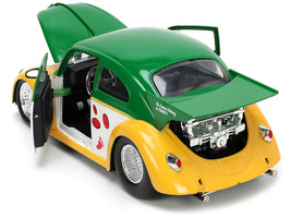 1959 Volkswagen Drag Beetle Green and Yellow and Michelangelo Diecast Figure "Te - $51.49