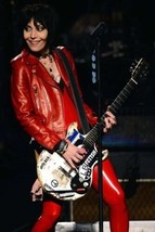 Joan Jett smiling in red leather jacket and pants playing guitar 18x24 poster - £23.59 GBP