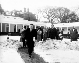 President John F. Kennedy walks through snow on White House lawn Photo Print - £6.88 GBP