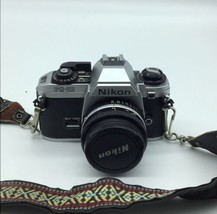 Nikon FG-20 Silver 35mm SLR Film Camera w/ 50mm f/1.8 E Series Lens - $93.19