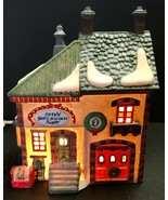 Dept 56 North Pole Series #56219 ORLY&#39;S BELL &amp; HARNESS SUPPLY Lighted Bu... - £27.89 GBP