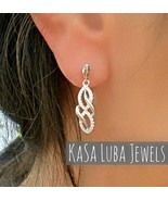 CZ Sterling Silver Infinity Earrings: Tarnish Free - $899.87 MXN