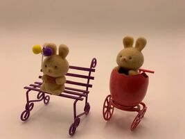 Pair of Avon Spring Bunny Figurines Bench with Balloons and Easter Egg S... - $6.90