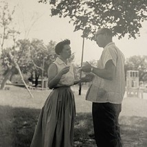 Found B&amp;W Photo Snapshot Man And Woman In Skirt At Picnic 1950s - £7.07 GBP