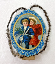 Victorian Paper and Tinsel Christmas Tree Ornament Boy and Girl on Bicycle - $18.32