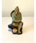 Vintage SHIWAN CHINESE FISHERMAN/MUD MAN Sitting on Boulder Ceramic Figu... - $21.06 CAD