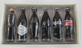100 Years of Coca Cola Miniature Bottle set. - $596.22 MXN