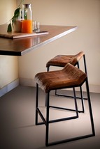 27 Inch Brown And Black Iron Backless Counter Height Bar Chair - $5,000.53 MXN