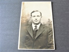  Serious looking Man - Real Photo Postcard-Stamp Box-AZO (1918-1930).     - £9.49 GBP