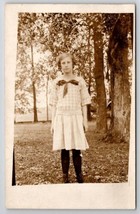 RPPC Sweet School Girl in Plaid near Lake in Forest Scene Postcard C25 - £7.82 GBP