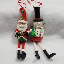SANTA CLAUSE And SNOWMAN  Christmas Dangling Long Legged Christmas Ornam... - $129.02 MXN