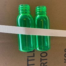 1oz PET clear cosmo round bottle with 20-410 neck finish- 1000/Case Green - $371.25