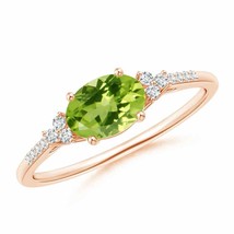 ANGARA Horizontally Set Oval Peridot Solitaire Ring with Trio Diamond Accents - £643.50 GBP