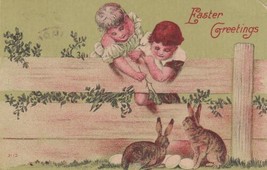 Easter Greetings Postcard Children Feeding Bunny Rabbits over Fence Eggs - £2.34 GBP