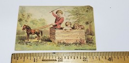 Victorian Trade Card CHILDREN PLAYING WAGON PULL TOY Shober Carqueville ... - $6.75