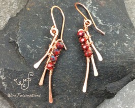 Handmade copper earrings: abstract wire wrapped wings with faceted red beads - £23.32 GBP