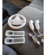 2 wii nunchucks Plus 2 Wii Skins And A Wii Wheel - $20.92