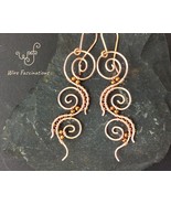 Handmade copper earrings: three wire wrapped spirals - €28,24 EUR