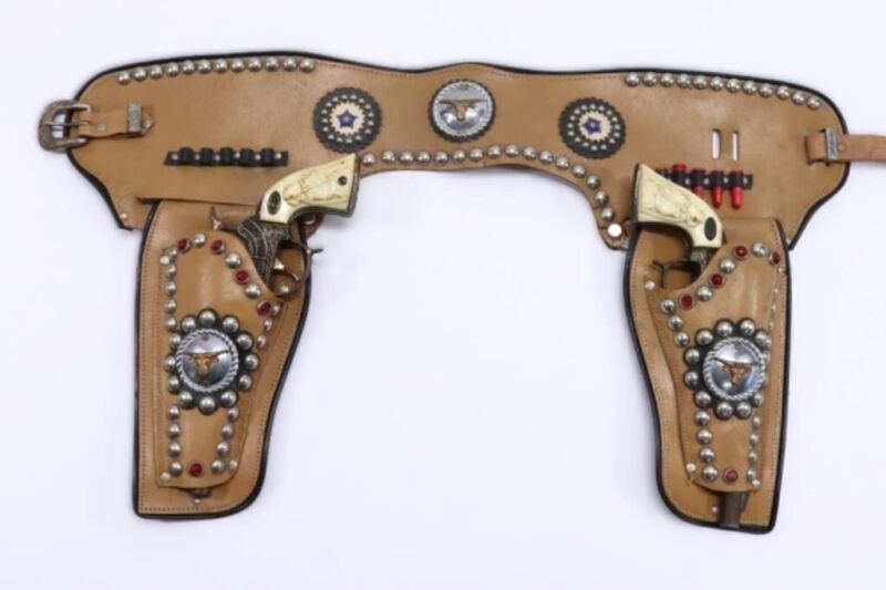 Primary image for Gene Autry .44 Cap Guns In Bronze With "L-H" In The Ellipse Plus A Fancy Holster