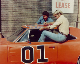 Tom Wopat and John Schneider in The Dukes of Hazzard climbing into General Lee 1 - £55.81 GBP