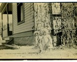 Baby Standing and Holding on to Outdoor Spigot Real Photo Postcard 1910 - $17.82