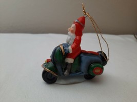 Old Style Santa Claus St. Nick Riding a Scooter Bisque Christmas Ornament - £12.35 GBP