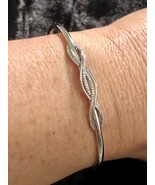 1/10 Carat T.W. White Diamond Sterling Silver Twist Bangle Bracelet - $2,433.23 MXN