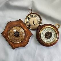 Two barometers and a thermometer. Set of 3 - $100.00