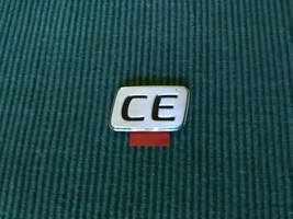 Toyota Corolla CE stainless silver look and black emblem new OEM - $14.00