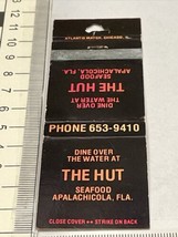 Vintage Matchbook Cover The Hut Seafood restaurant Apalachicola, FL gmg ... - £9.73 GBP