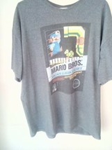 NINTENDO! THE OFFICIAL MARIO BROS TSHIRT AND YOSHI STUFFED TOY.  - $10.88
