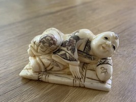 Vintage Japanese RESIN Netsuke of Man Laying on Bamboo Mat Carved Painted - $98.99