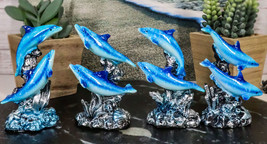 Pack Of 4 Marine Sea Blue Dolphins Swimming By Waves And Coral Reef Figu... - $21.99