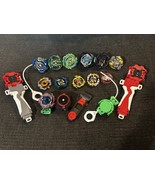 BeyBlades Bursts Launchers Ripcords Battle Spinners Lot - $380.13 MXN