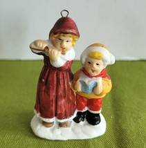 Mini Christmas Village Accessory/Ornament Lady and Child Caroling Porcel... - $6.92