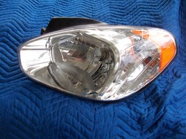 2007 ACCENT 4 DOOR LEFT HEAD LIGHT OEM USED ORIGINAL HYUNDAI PART 2008 2... - $125.38