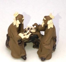 Miniature Ceramic Figurine Two Mud Men Sitting On A Bench Reading Books ... - £5.54 GBP