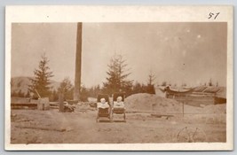 RPPC Two Babies In Carriages on Building Construction Site Postcard H21 - £10.16 GBP