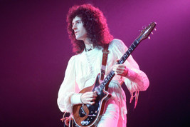 Queen Brian May plays guitar in concert 18x24 Poster - $23.99