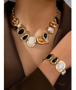 lack tortoise  Geometric necklace bracelet set - $414.68 MXN