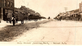 Bryant SD South Dakota Main Street View Postcard RPPC Dirt Road Horse Wagon - £30.98 GBP